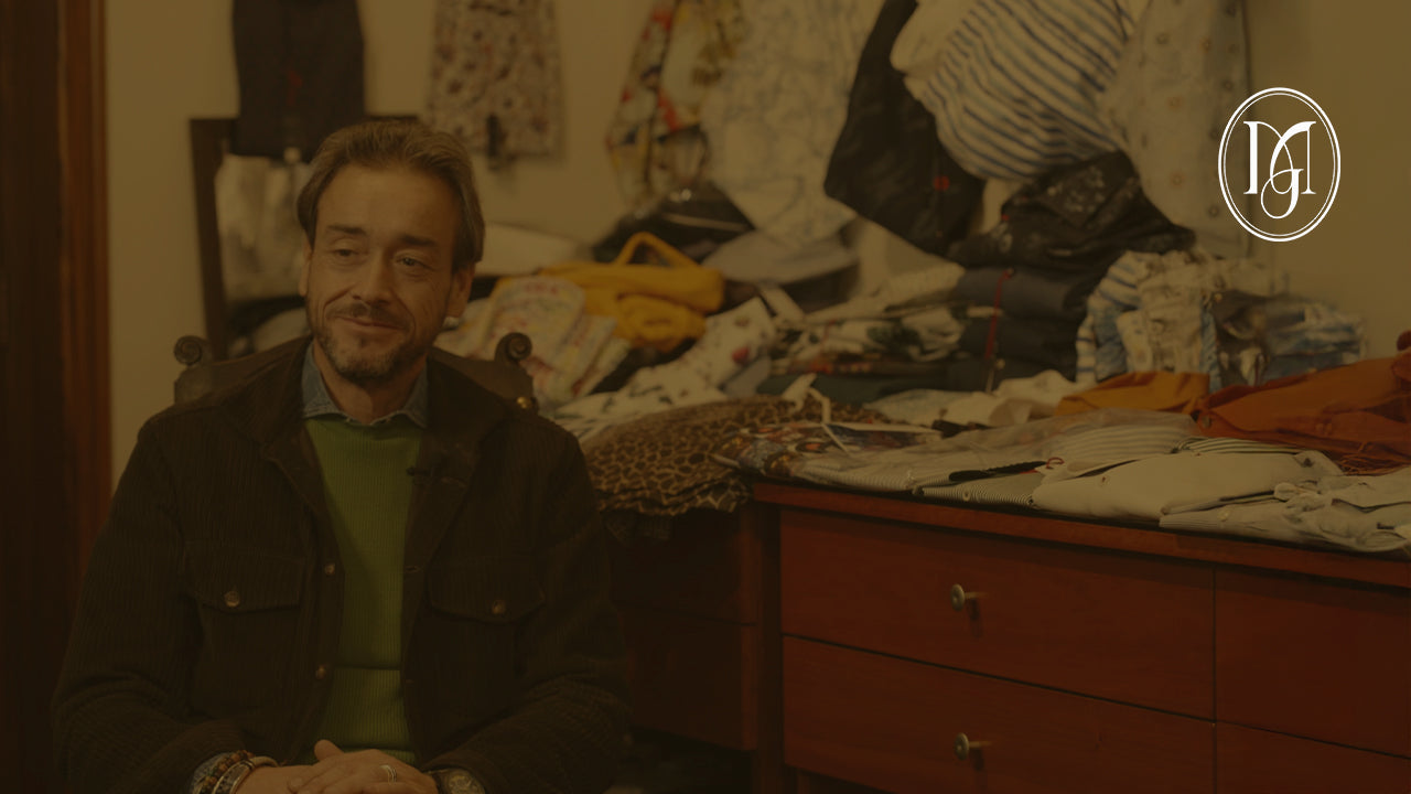 A man sitting on a sofa for an interview