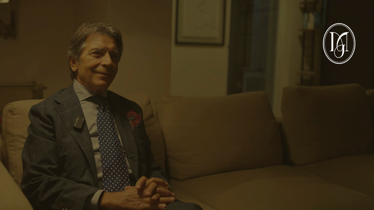 A man sitting on a sofa for an interview